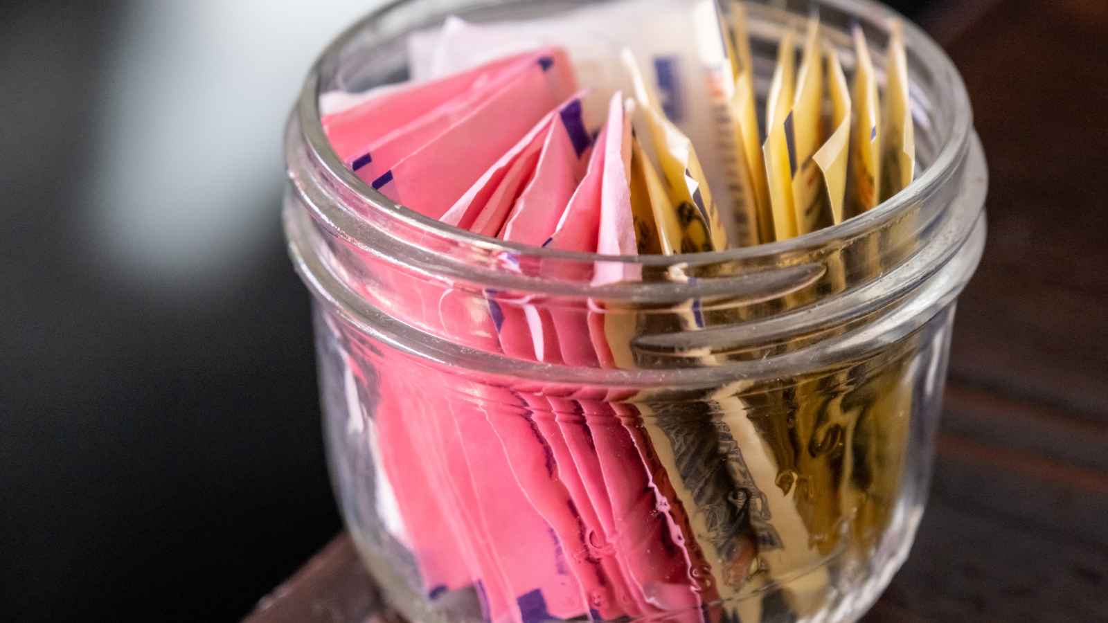 <p>Many people turn to artificial sweeteners to cut calories, but these substitutes don’t come without a cost.  Some studies suggest they can increase preference for sweet tastes, which may lead to overeating sweet foods. A study in JAMA found a link between consuming artificial sweeteners and a higher risk of high blood pressure, diabetes, and heart disease.</p><p>The key is moderation. Limit intake to only a few packets daily. You can also use natural sweeteners like stevia or small portions of pure honey or maple syrup as safer substitutes. Alternatively, you can gradually reduce sugar intake to adapt to a less-sweet diet.</p>