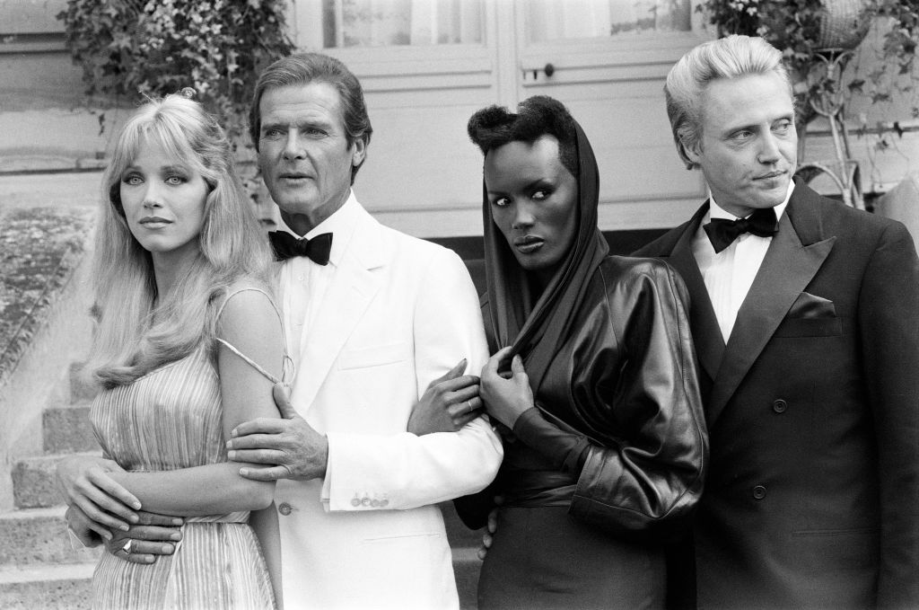 <p>Jones with her fellow cast-mates in the film <em>A View to a Kill</em>, a 1984 James Bond film in the Roger Moore era. Jones plays May Day, the powerful henchwoman of the villain Max Zorin, played by Christopher Walken.</p>