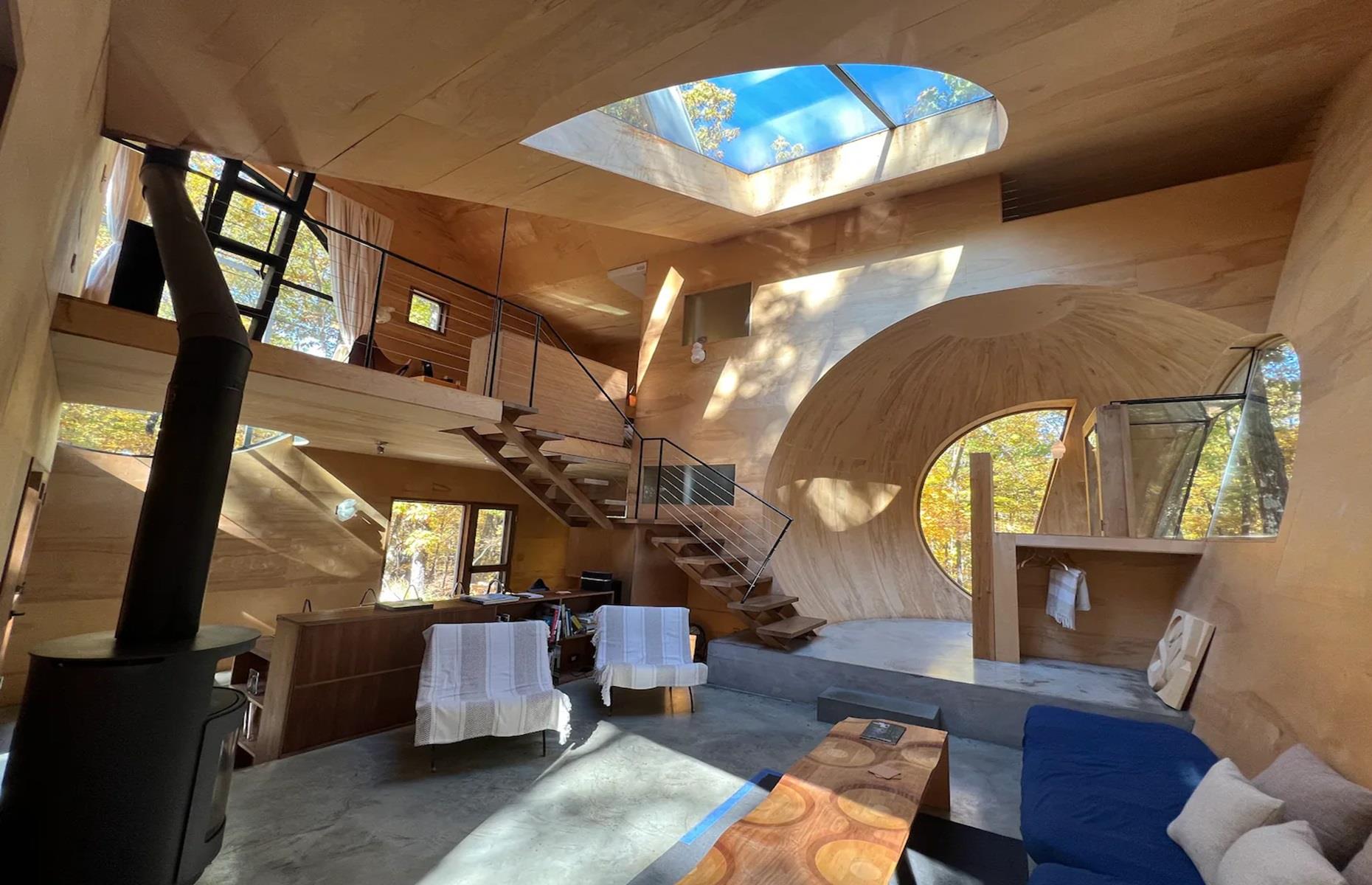 <p>The project aimed to create a unique vacation retreat that preserves the natural landscape and habitats around it. "Instead of building today’s typical 'McMansion' of several thousand square feet", the architects instead opted to create a single house of just 918 square feet, with three spherical voids at its centre, resulting in a truly unusual interior.</p>