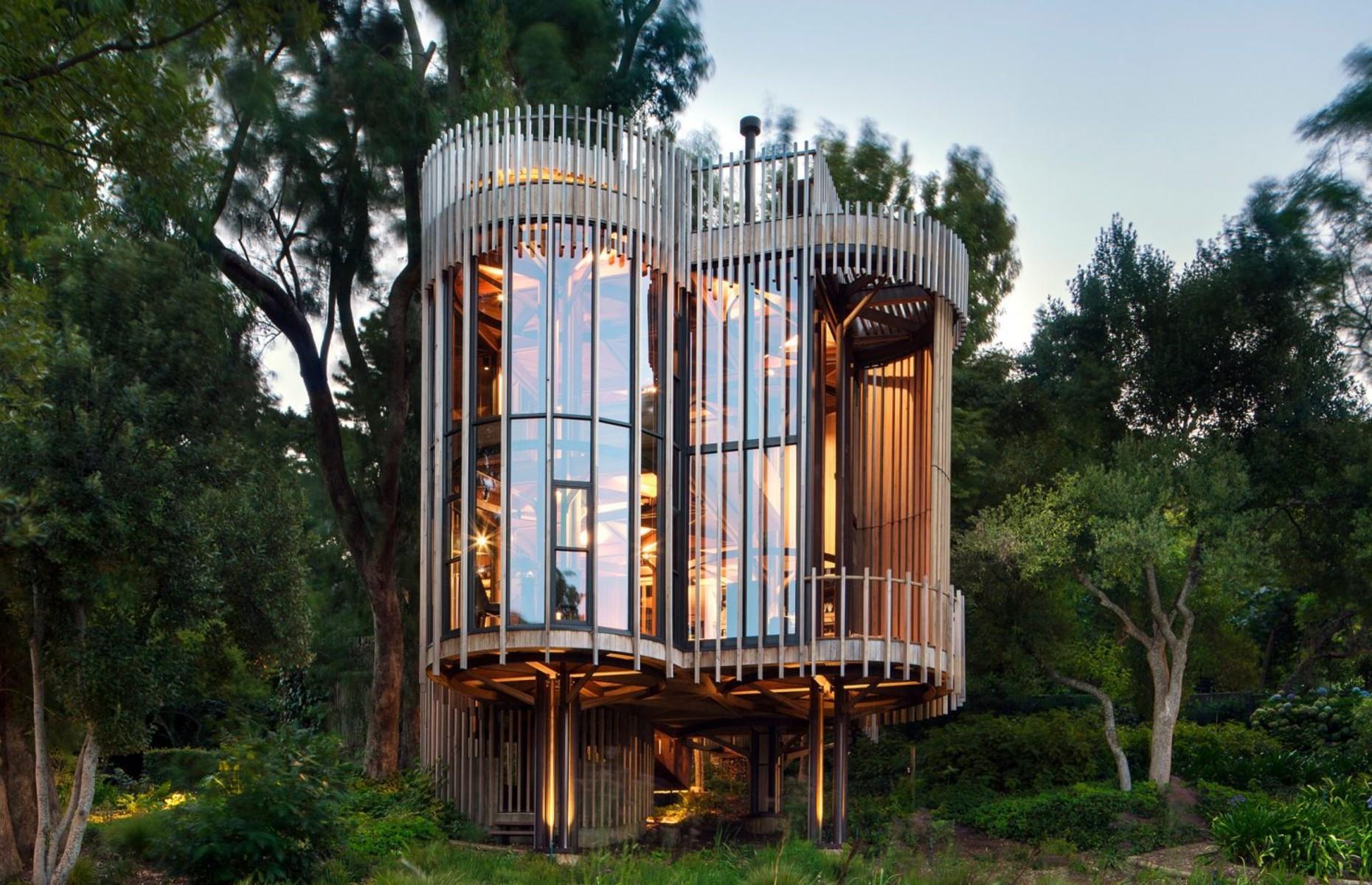 <p>Designed by Cape Town-based architecture studio <a href="http://www.malanvorster.co.za/">Malan Vorster</a>, this spectacular treehouse is the ultimate wilderness retreat. Formed from glass and four cylindrical towers of untreated red cedar, the one-of-a-kind tiny home merges into its woodland setting. Built on a steep sloping plot, the house is elevated off the ground by stilts, in a bid to preserve the surrounding environment. </p>