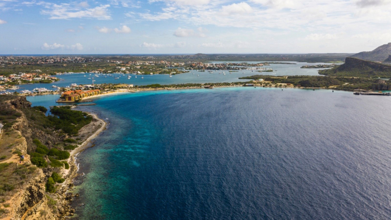 <p>Just a few hours away from Bonaire is the island of Curaçao. Head on over to Caracas Bay for some fantastic snorkeling adventures. One of the coolest sites is a well-preserved sunken tugboat. Snorkelers can get up close and personal with this sunken ship covered in reefs, crabs, and other sea life.</p>