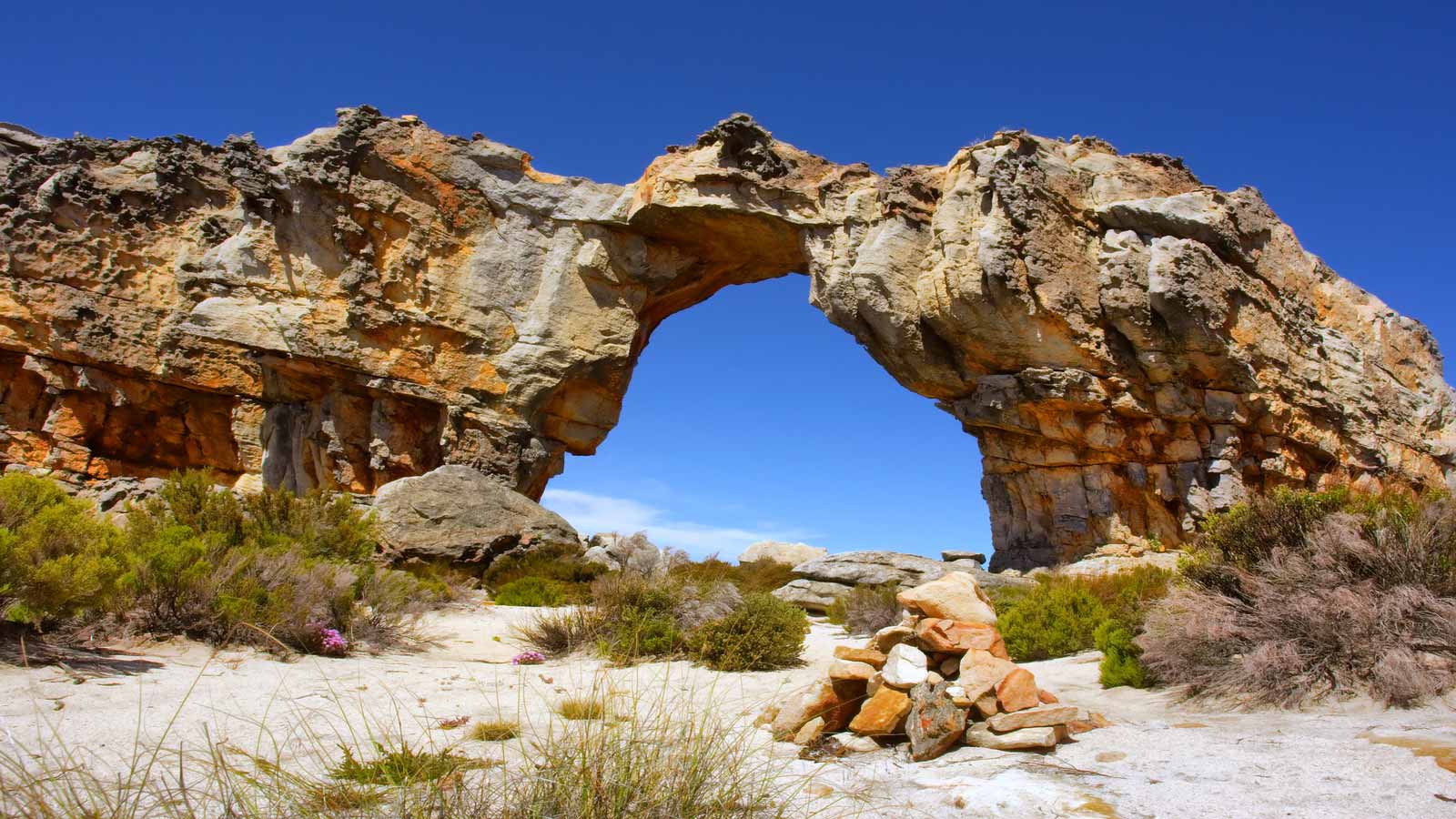 <p>The Cederberg is another adventurer’s paradise. Hike to the Wolfberg Arch and soak in uninterrupted views of the Milky Way. The unique rock formations and San rock art make this region of the Western Cape a popular destination for locals and tourists. </p><p>Have fun visiting this incredible country — a place I call home.</p><p>Images courtesy of <a href="https://depositphotos.com/" rel="nofollow noopener">Depositphotos.com</a>.</p><p>Follow The Happiness Function on <a href="https://twitter.com/thehappinessfxn" rel="nofollow noopener">Twitter</a>, <a href="https://www.instagram.com/thehappinessfxn/" rel="nofollow noopener">Instagram</a>, <a href="https://www.facebook.com/thehappinessfxn/" rel="nofollow noopener">Facebook</a>, <a href="https://www.tiktok.com/@thehappinessfxn" rel="nofollow noopener">TikTok</a> and <a href="https://www.youtube.com/channel/UCYXMvMbJekTvubxhq0GdPlA" rel="nofollow noopener">YouTube</a>.</p><p><strong>More Articles From The Happiness Function:</strong></p><ul> <li><a href="https://thehappinessfxn.com/things-to-do-in-colorado/">15 Epic Outdoorsy Things To Do in Colorado</a></li> <li><a href="https://thehappinessfxn.com/best-all-inclusive-resorts-near-playa-del-carmen/">10 Dreamy All-Inclusive Resorts Near Playa del Carmen</a></li> </ul>