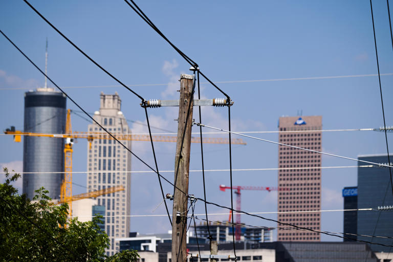 Utility wires in Atlanta. Georgia regulators want to protect ratepayers while ensuring there is enough power for the state’s most-prized new tenants: clean-tech companies. (Bloomberg News/Getty Images)