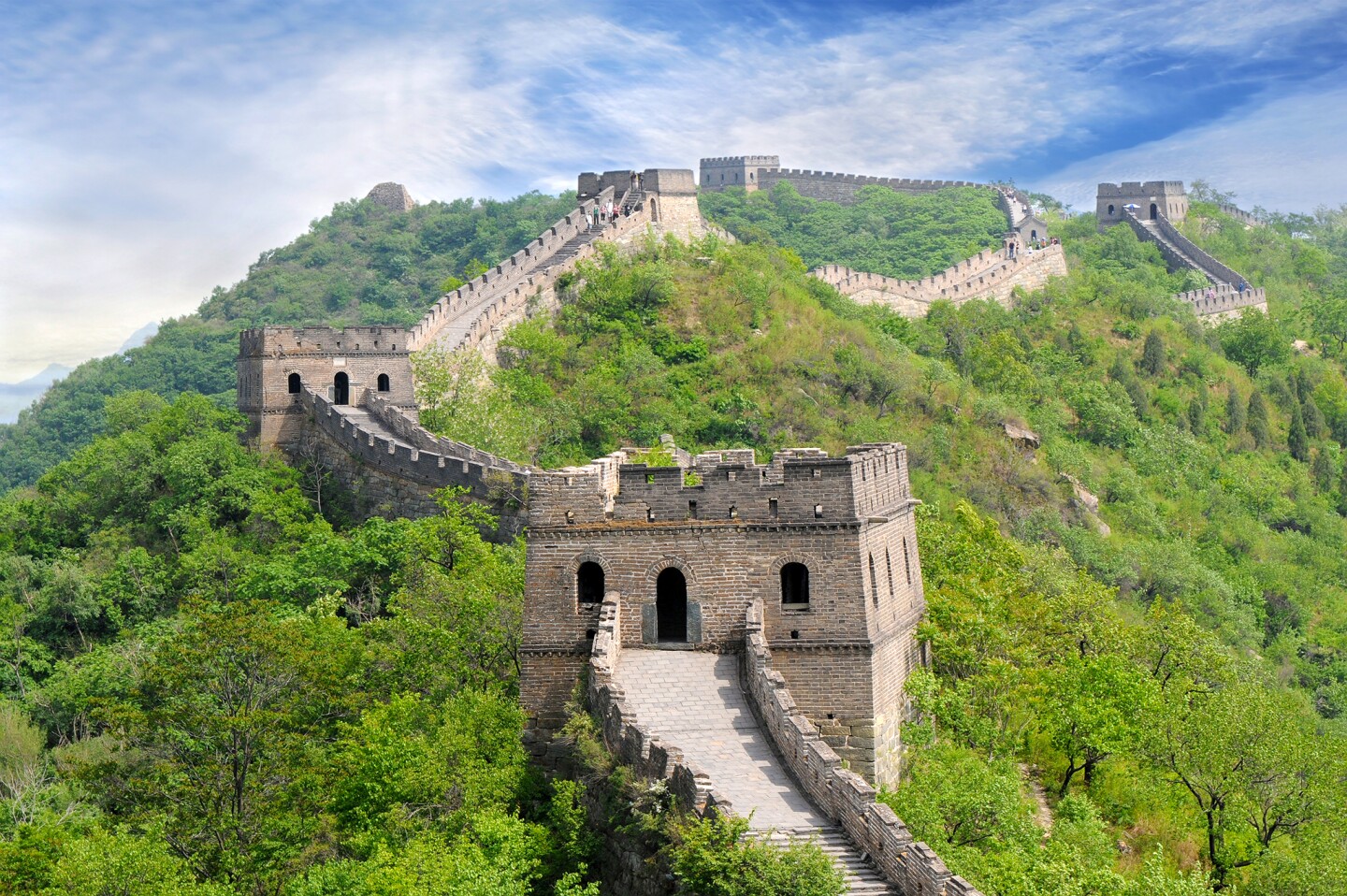 <h2>9. The Great Wall of China</h2> <p><i>China</i><br> It took more than 2,500 years to build <a class="Link" href="https://whc.unesco.org/en/list/438" rel="noopener">the Great Wall</a>, China’s most recognizable symbol, which snakes through the northern part of the country for more than 13,000 miles. During the 8th century B.C.E., the Zhou dynasty–era state of Chu began construction on the wall to protect against foreign invaders. Most tourists explore a section or two of the stone-and-brick fortification; it would take approximately 177 days of nonstop walking to see the entire wall. </p> <h3>How to visit</h3> <p> Frequently visited sections of the wall include Mutianyu and Jinshanling. The former is a 90-minute drive from Beijing and an easy day trip; the latter takes twice as long to reach but is one of the wall’s most well-preserved sections and is popular with hikers. Each section of the wall requires its own entry ticket. The cost is typically about $6 to $8, although prices vary.</p>