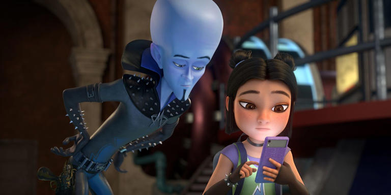 Megamind looking at Keiko on her phone in Megamind Rules
