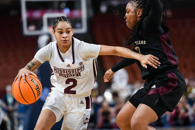 Mississippi State guard Jerkaila Jordan (2) moves the ball past Texas A & M guard Tineya Hylton (3) during the third quarter of the SEC Women's Basketball Tournament game three at the Bon Secours Wellness Arena in Greenville, S.C. Thursday, March 7, 2024.