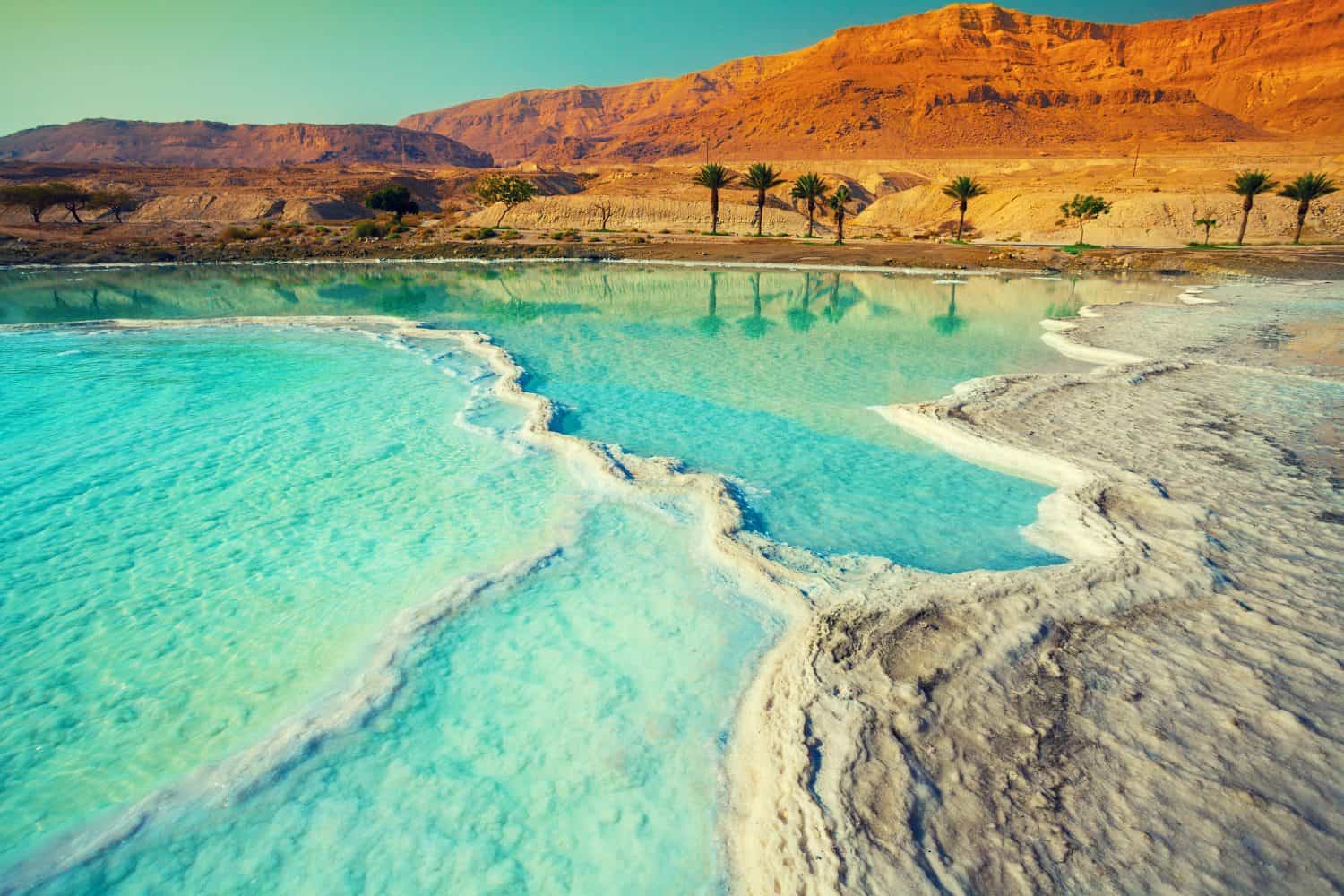 <ul> <li><strong>Location:</strong> Between Israel and Jordan, Southeast Asia</li> <li><strong>Known For:</strong> Being one of the saltiest bodies of water with a high mineral count</li> </ul> <p>One of the travel destinations that may not be around much longer is the Dead Sea, one of the saltiest bodies of water with the highest mineral count. The inbound lake is so salty that tourists practically float when they sit in it. Many factors play a part in the receding of the Dead Sea shoreline. First, man-made problems include gathering the minerals to export them and shifting the freshwater sources away from the Dead Sea for use. These reasons, which include global warming, contribute to the lake drying up. Additionally, water levels drop around <a href="https://eros.usgs.gov/earthshots/rates-of-decline">3 to 4 feet every year</a>, and the receding shoreline has caused dangerous sinkholes, one of which swallowed a parking lot. While the Dead Sea may not completely disappear, if something isn't done to preserve it, it may become more challenging for tourists to experience its wonder and history.</p>