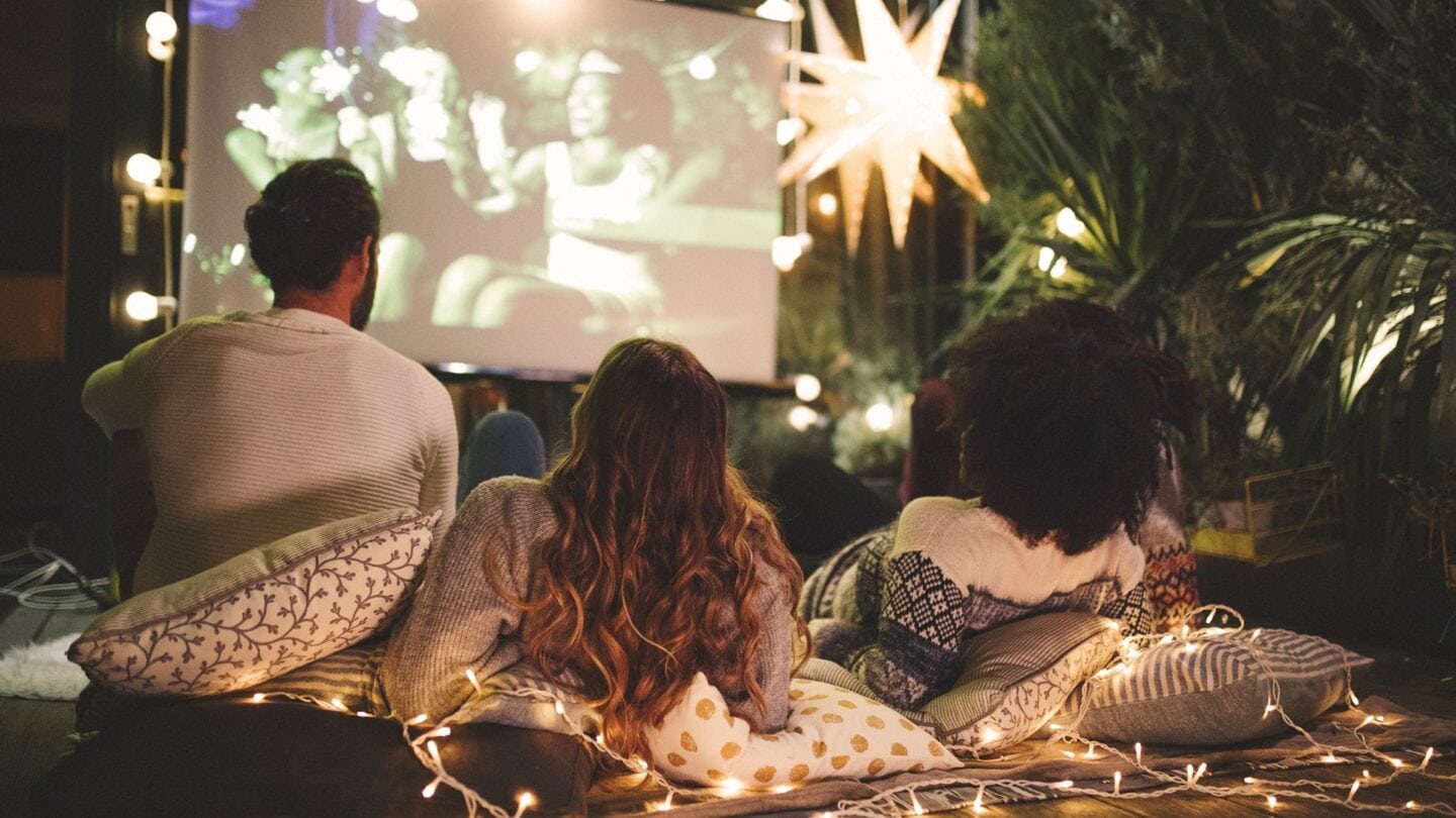 <p class="has-text-align-center"><strong>Photo Credit:</strong> Canva Pro</p> <p>Creating the right ambiance is essential in setting the mood for your outdoor movie night. String up twinkling fairy lights or vintage-style bulbs to add a touch of enchantment to your backyard. Combine them with lanterns or flameless candles strategically placed around the seating area to provide soft, atmospheric lighting. This enhances the viewing experience and adds a magical ambiance that transports guests to a Hollywood paradise.</p>