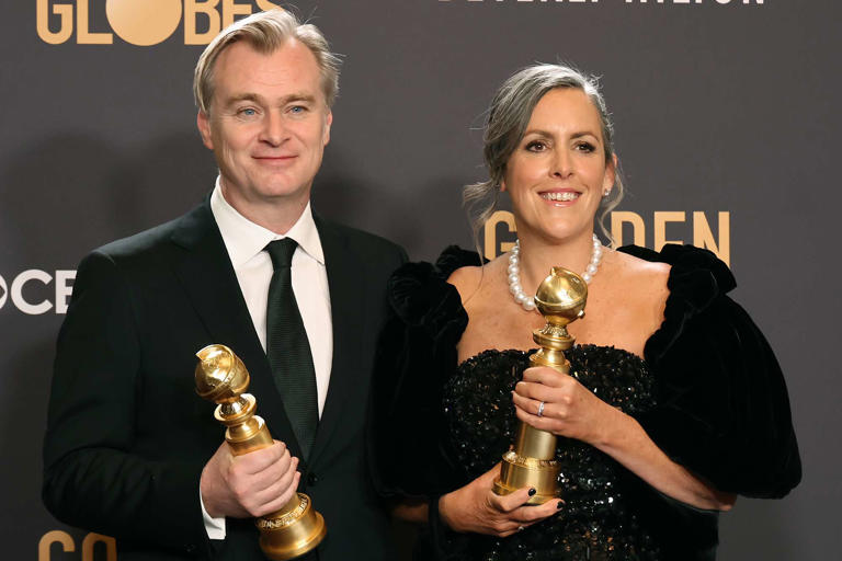 Amy Sussman/Getty Christopher Nolan and Emma Thomas pose in the press room during the 81st Annual Golden Globe Awards on January 07, 2024.