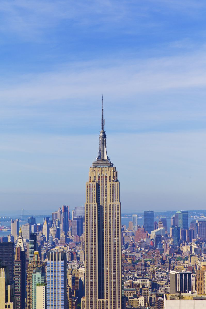 <p>With construction beginning in 1930, the <a href="https://www.esbnyc.com">Empire State Building</a> in New York was to be the world's first with more than 100 stories. The steel framework, considered a modern marvel, rose four and a half stories a week and was completed in a record one year and 45 days when it opened in 1931. </p><p>The building, designed by the firm Shreve, Lamb and Harmon, exhibits Deco elements such as the verticality of the windows, setbacks, and a combination of industrial and traditional materials. The lobby, restored in 2009, also is a masterpiece of Art Deco with gilt embellishments and striking artistic odes to mechanical progress. </p>