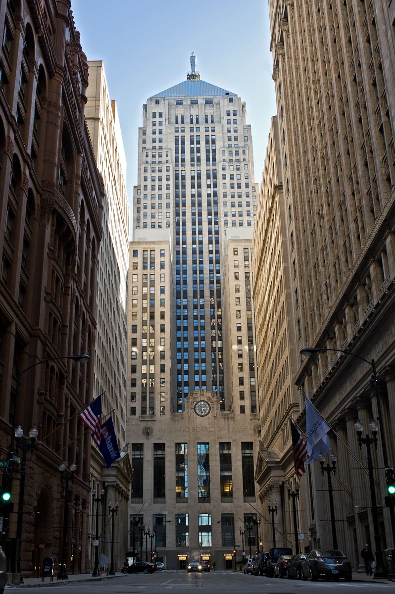 <p>The <a href="https://www.architecture.org/learn/resources/buildings-of-chicago/building/chicago-board-of-trade-building/">Chicago Board of Trade Building</a> was completed in 1930 by the celebrated Windy City firm Holabird & Root as the center of the city's financial district. Gray limestone and dark recessed windows give this imposing building a strong vertical appearance that epitomizes the Art Deco style. Geometric and abstract exterior ornamentation and an aluminum stylized statue of Ceres atop the building adds to the overall Deco effect. </p>