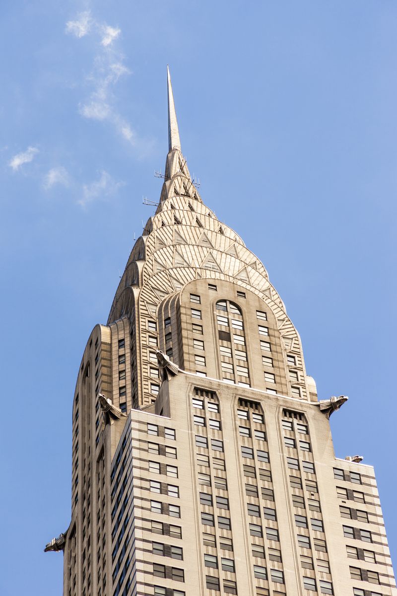 <p>Built under commission of automotive entrepreneur Walter P. Chrysler, the <a href="https://chryslerbuilding.com/history/">Chrysler Building</a> in New York, designed by William Van Alen, was completed in 1930 and held the title as tallest building in the world until the following year. In the 1930s, a Chrysler dealership was on the first two floors.</p><p>The Art Deco elements are numerous and stunning: Triangular windows, gorgeous color and sheen derived from the use of metal, and building ornamentation to mimic a Chrysler automobile, including a 1929 hood ornament, hubcaps, and running board. </p>