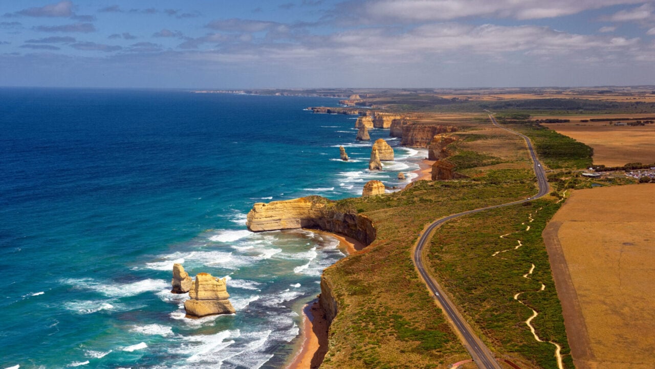 <p>Along the coast of the southwest Victoria region, you’ll be able to drive down one of the most scenic roads in the world. The natural beauty here is unlike anywhere else — you can stop by the Loch Ard Gorge beach or find your ideal place to surf, as Australia has the perfect climate to try your hand with a board on the water.</p>