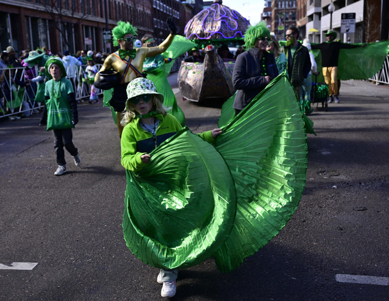 Addali Gepford, 9, dances ahead of the Wells Family Law float during Denver’s annual St. Patrick’s Day Parade in downtown Denver on Saturday, March 16, 2024. Thousands of parade goers flocked to lower downtown Denver to enjoy the parade which had over 120 floats and entries that featured dancers, marching bands, dignitaries, police and fire departments, clowns, car clubs and many other organizations.
