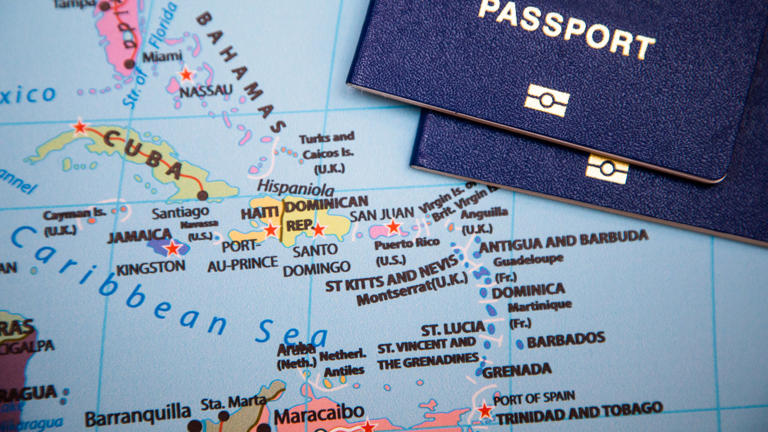 Passports on a map of the Caribbean region.