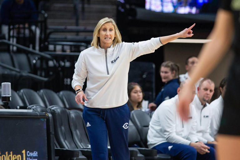 UC Davis Aggies women's basketball coach Jennifer Gross calls a play against Sacramento State during the Causeway Classic in 2022.