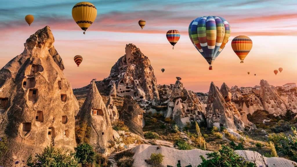 <p>Cappadocia is a perfect holiday destination thanks to its picture-perfect scenery and many activities. The landscape is known for its unique rock formations, including chimneys and caves, created after years of erosion. </p><p>Take hot air balloon tours for panoramic views of the surreal landscapes, do photoshoots, or take guided tours for an immersion into the region’s rich history and culture. You may also go hiking or horse riding; there are many ways to experience this spectacular desert landscape.</p><p class="has-text-align-center has-medium-font-size">Read also: <a href="https://worldwildschooling.com/most-beautiful-countries/">Breathtaking Countries To Explore</a></p>