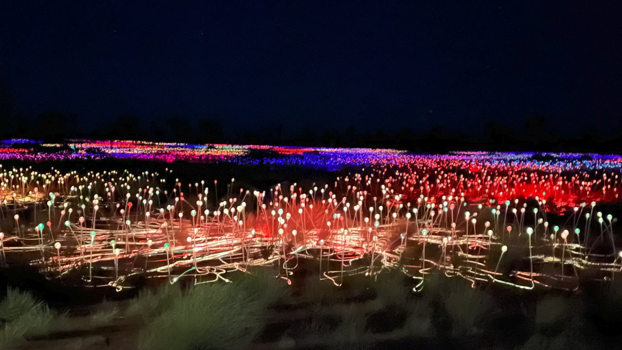 <p>In complete contrast to the natural wonder of Uluru is the Field of Light. This art installation was created by Bruce Munro in 2016. When the sun sets over the iconic red rock, the field comes alive with multiple colors illuminating the darkness of the desert. Fifty thousand colorful bulbs rise from the ground, symbolizing the profound connection between art, nature, and spirituality in this sacred Australian landscape. In the local language, it’s known as ‘Tili Wiru Tjuta Nyakutjaku.’</p><p>If you’re having trouble imagining its size, think of seven football fields together, and you’ll get a clearer picture. Not only will you get a chance to view the field from a distance to take photos, but you’ll also be able to wander through it. Be careful not to wander too far from your guide—it’s easy to get lost! </p><p>You also have the option to upgrade with canapes and drinks or a full dinner experience. The ‘Sounds of Silence’ is an award-winning event featuring a three-course Australian buffet dinner, wines, beers, and non-alcoholic options, a star talk, and a Didgeridoo performance.</p>
