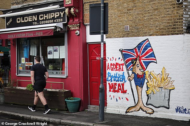 'are we not in britain?' furious greenwich residents say there is nothing wrong with union jack mural outside chip shop after council ordered owner to tear it down because they did not have planning permission