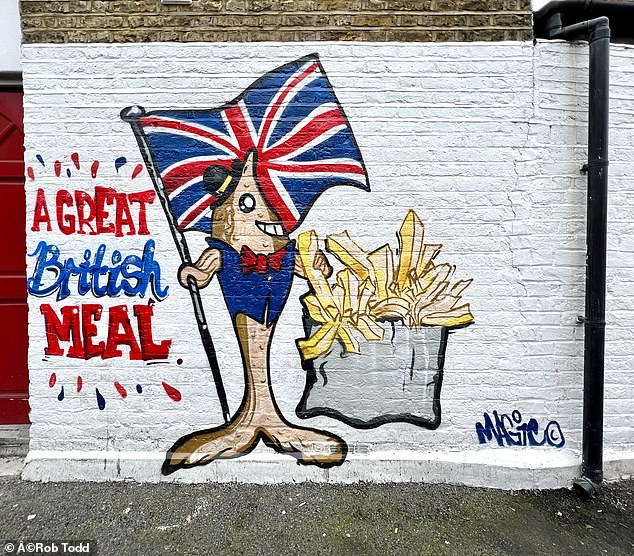 'are we not in britain?' furious greenwich residents say there is nothing wrong with union jack mural outside chip shop after council ordered owner to tear it down because they did not have planning permission