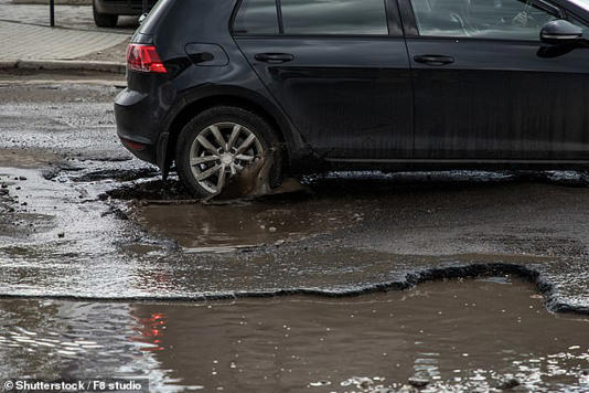 Heavier electric vehicles and larger cars are helping push Britain's crumbling roads to 'breaking point' a report has revealed (Stock image)