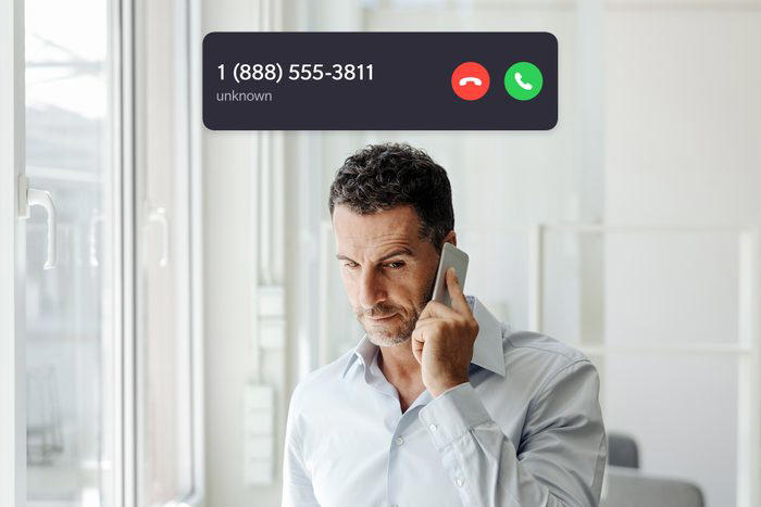 man with a serious look on his face talking on the phone with incoming call interface overlay