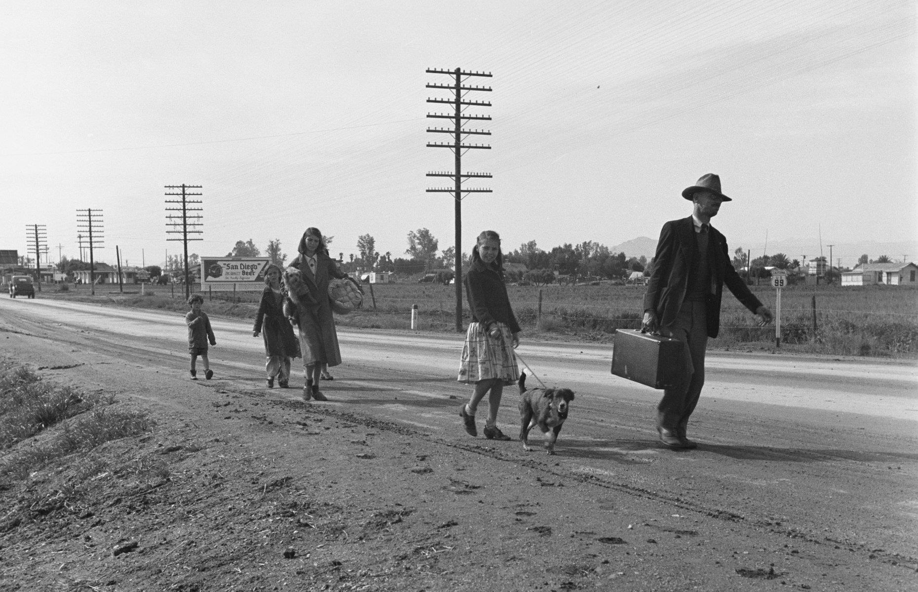 <p>Between 1935 and 1940, a quarter of a million Oklahomans traveled 1,300 miles to California, but they didn’t get a very warm welcome. Many settled in the San Joaquin Valley in search of agricultural work, but competition for jobs was intense and many ended up in tents and shantytowns.</p>  <p>'Okies' soon became a derogatory term for any poor migrants making their way to California, like this family of cotton pickers walking by the side of a highway from Phoenix, Arizona to San Diego.</p>