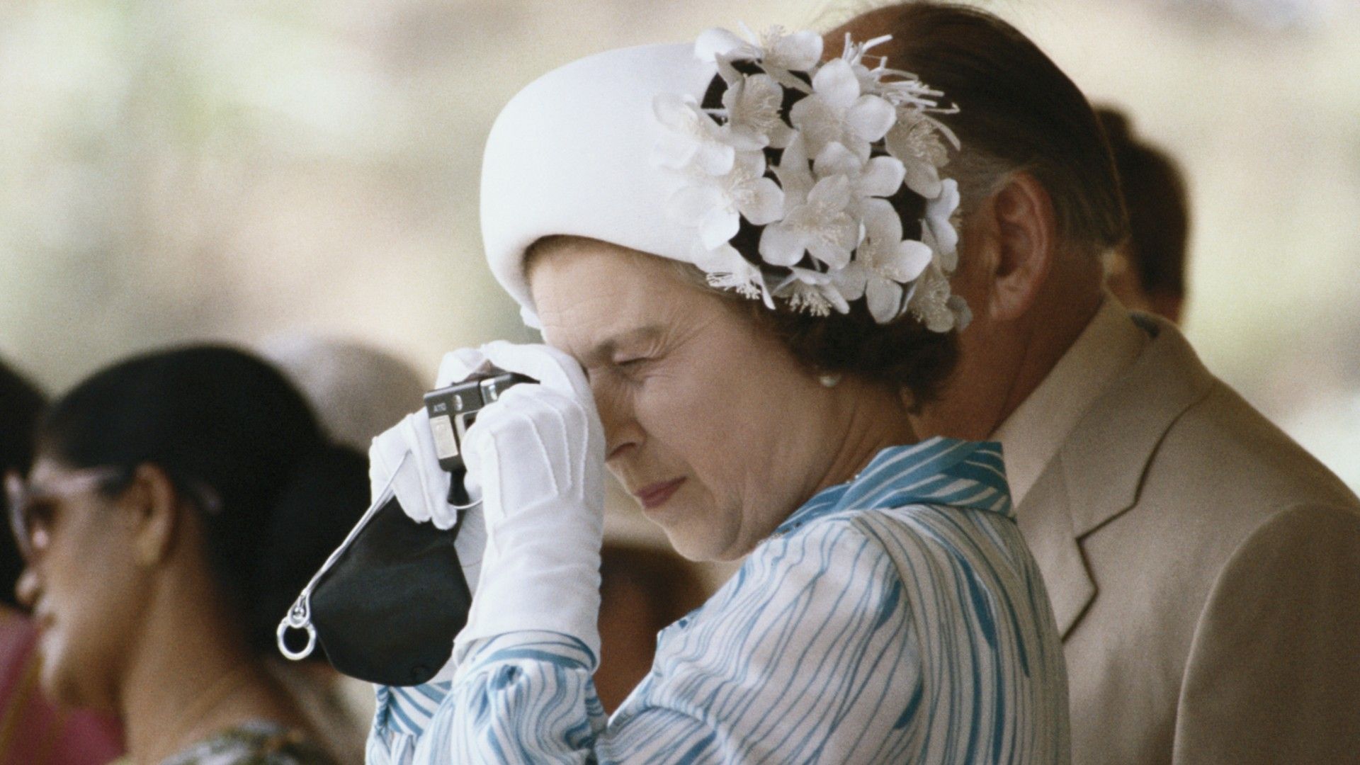<p>                     Though most of her life was spent in front of the camera, on the rare occasion, Queen Elizabeth II was seen taking photographs of her own during her royal tours. One such occasion was during an October 1981 trip to Sri Lanka.                   </p>                                      <p>                     During this trip, the Queen was photographed taking a snap on her Canon Sure Shot 110 camera, one of her many beloved cameras. It wasn’t clear what she was taking a photo of, but the aim of the trip – the second of three she made during her reign – was to visit the construction of Sri Lanka’s Victoria Dam, Sri Lanka’s largest hydroelectric project, which was constructed by a UK firm.                   </p>
