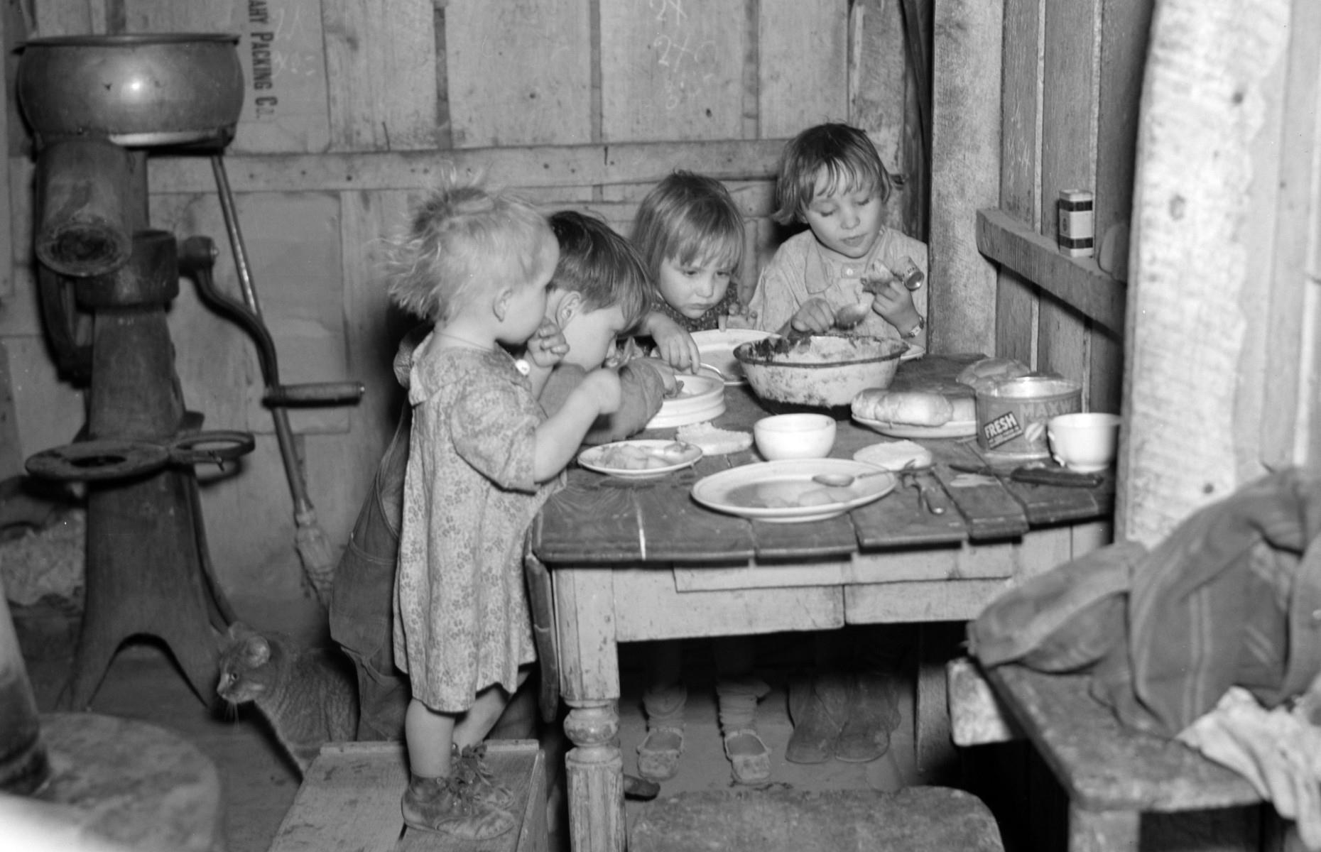 <p>Belts were fastened so tight that many families didn’t have cash to spare for Christmas in the 1930s, and the festive fare at this Christmas dinner in Iowa was potatoes, cabbage, and pie.</p>  <p>That said, some new Christmas traditions began during the Depression. In 1931, Santa Claus featured in published Coca-Cola adverts for the first time and a free storybook given away to customers at one store in 1939 introduced the world to Rudolph the Red-Nosed Reindeer.</p>