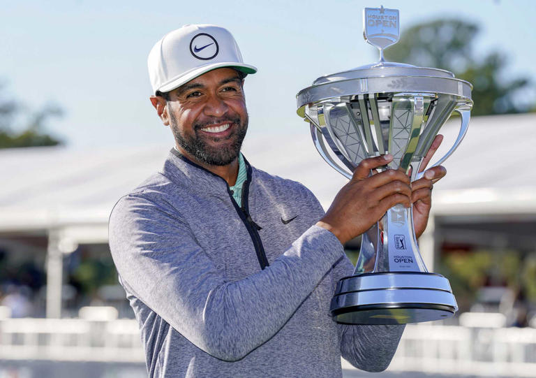 Tony Finau holds the champion's trophy after winning the Houston Open in Novermber 2022.