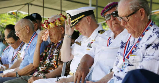 World War II veterans attend a 2014 ceremony to honor the war of Saipan. By: MEGA