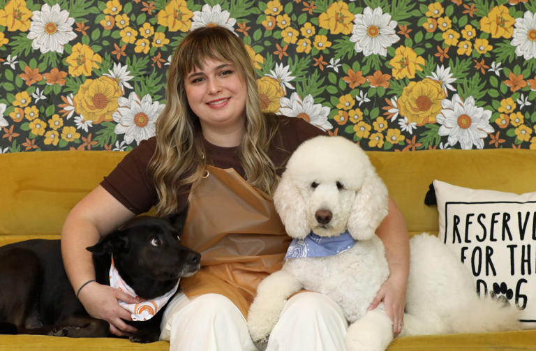 Owner Baylee Pinkelton poses with “Ruth” and “Petunia” at Hippie Hounds Dog Grooming on East Central Avenue in Mount Holly early Monday morning, March 25, 2024.