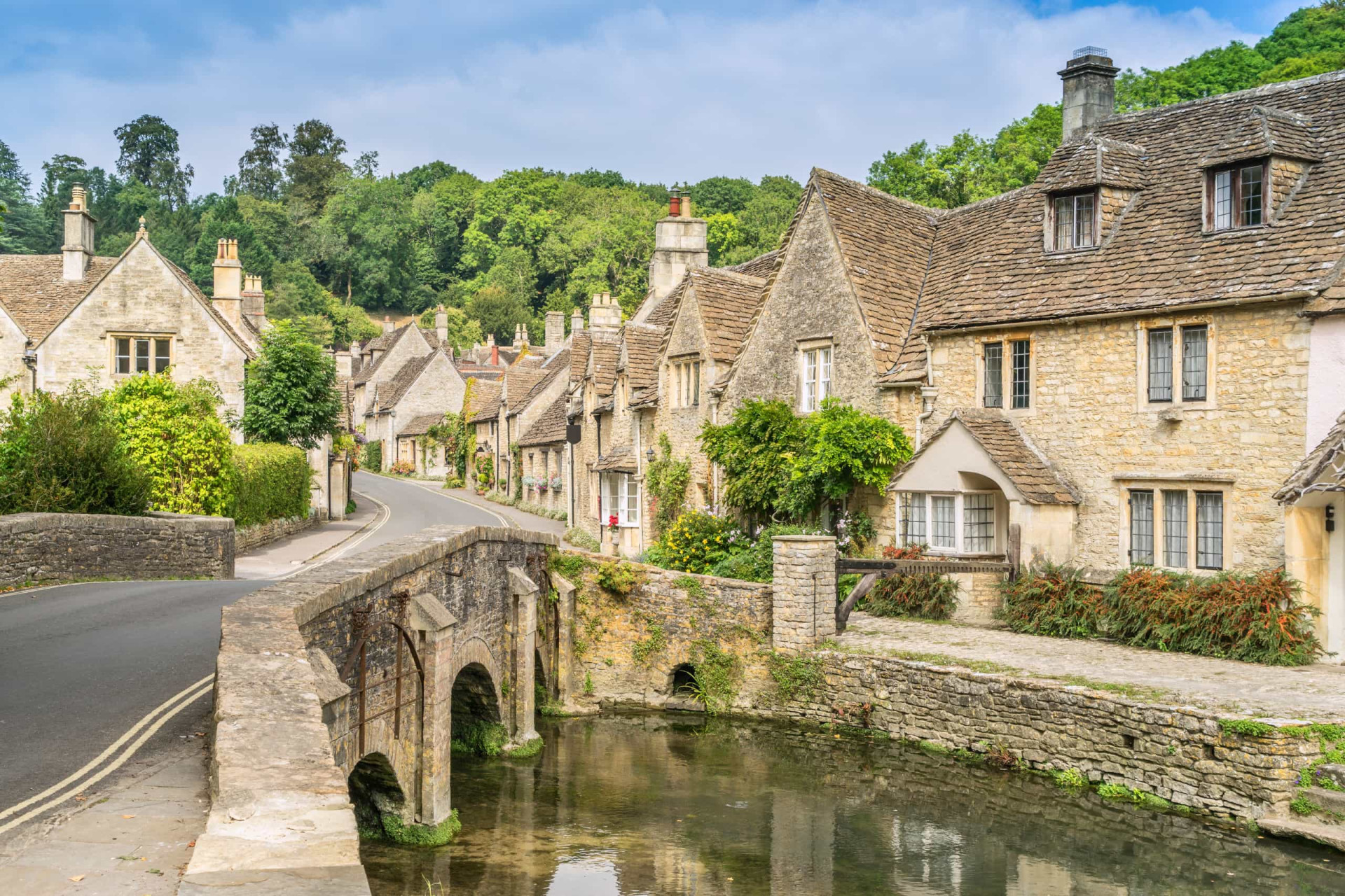 <p>Castle Combe in Wiltshire is repeatedly voted one of the best towns in the UK for both its looks and community. It is located in the Cotswolds and is known for its signature sandy brickwork and a working medieval clock.</p>
