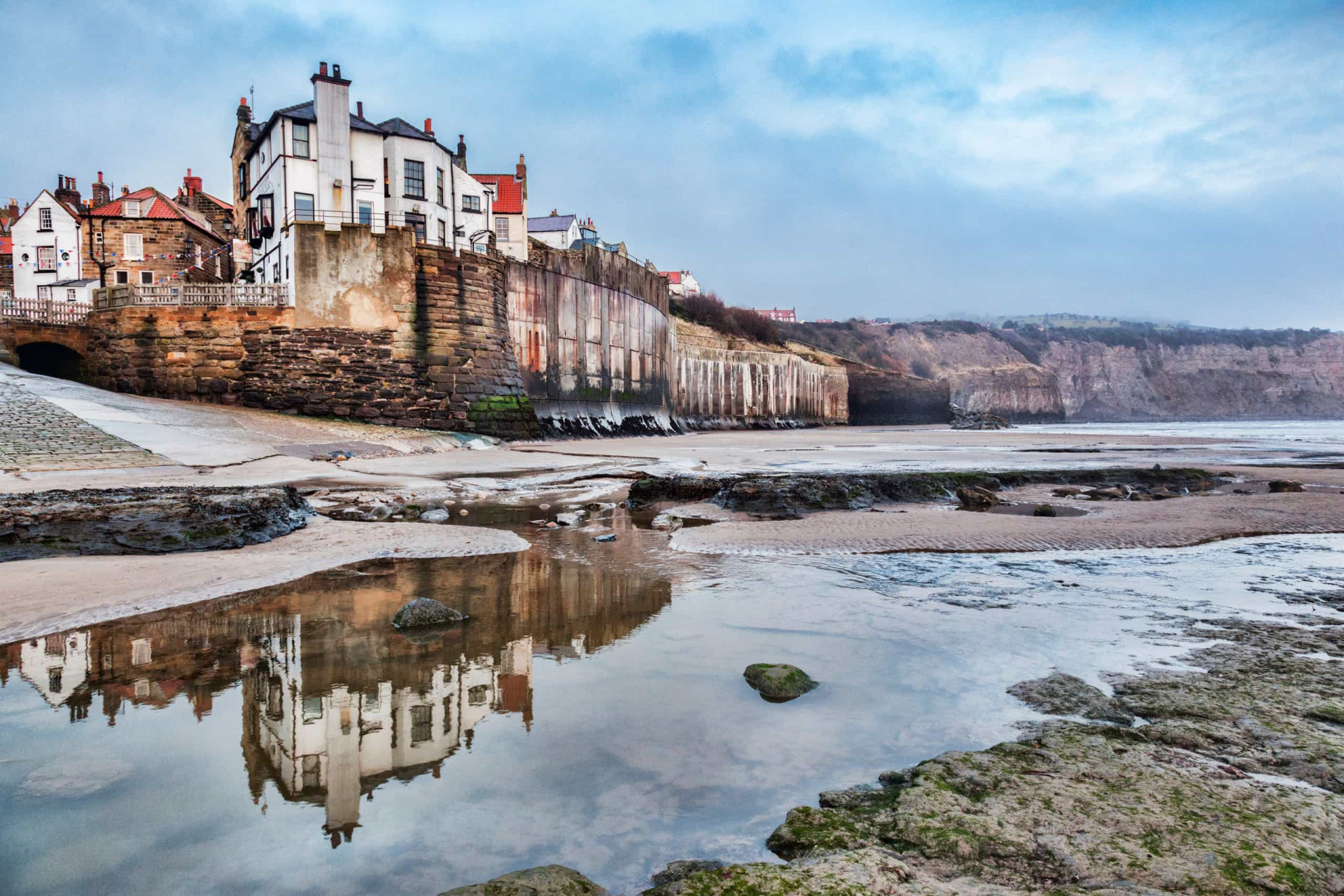 <p>As the name would suggest, Robin Hood's Bay in Whitby is where smugglers used to come in from the sea. There are tunnels going underneath the town where the thieves used to transport brandy, whisky, and other contraband. It has a fantastic history and a very charming appearance to boot.</p>