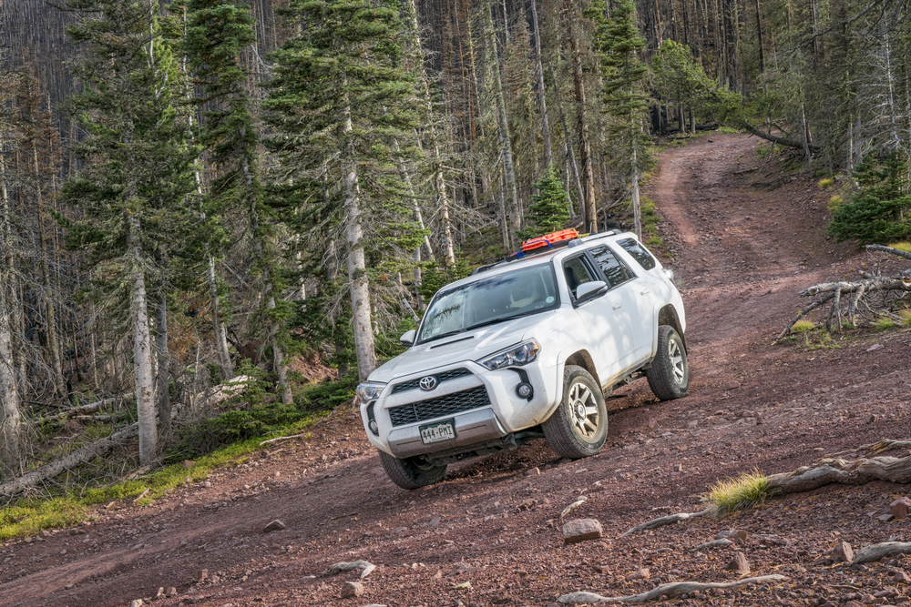 <p>The Toyota 4Runner’s rugged body-on-frame construction and true four-wheel-drive capabilities make it a superb vehicle for off-grid camping. With a ground clearance of 9.6 inches, it can easily handle rough terrains. In addition, its large cargo space of 47.2 cubic feet (up to 89.7 cubic feet with the rear seats folded) provides ample room for camping equipment.</p>