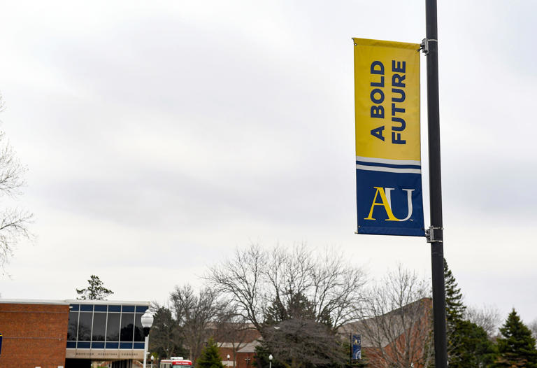 A sign for Augustana University hangs from a lamp post on Tuesday, April 27, 2021, on Augustana's campus in Sioux Falls.