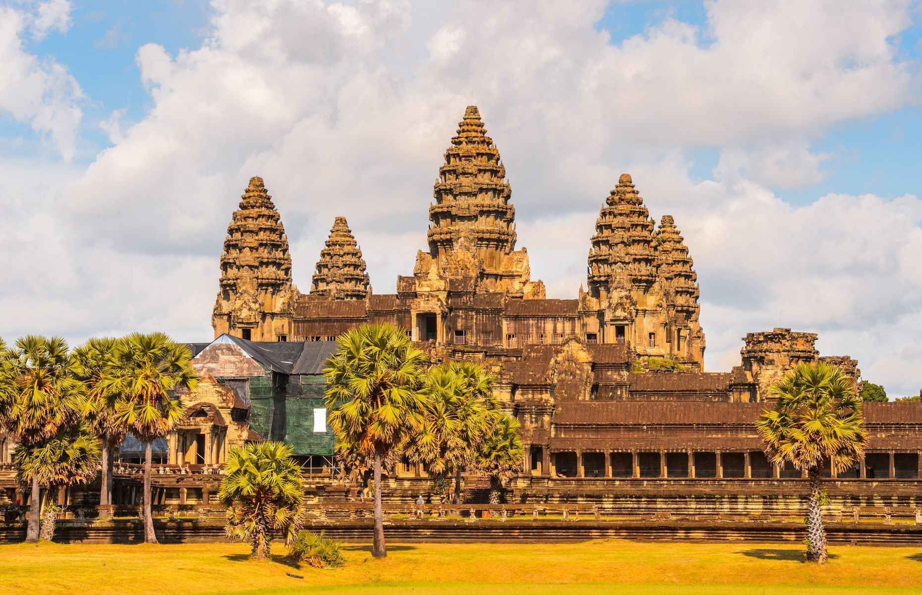 <p>Dating from the 12th century, the temple of Angkor Wat is the <a href="https://www.britannica.com/topic/Angkor-Wat" rel="noreferrer noopener">largest religious monument in the world</a>. Originally built in honour of the Hindu god Vishnu, it’s now maintained by Buddhist monks and has come to symbolize the Khmer nation. Characteristic bas-reliefs and lotus bud towers have made Angkor Wat a major cultural attraction in Asia. Indeed, <a href="https://www.phnompenhpost.com/business/angkor-hosts-26m-visitors" rel="noreferrer noopener">2.6 million foreign tourists</a> visited the site in 2018.</p>