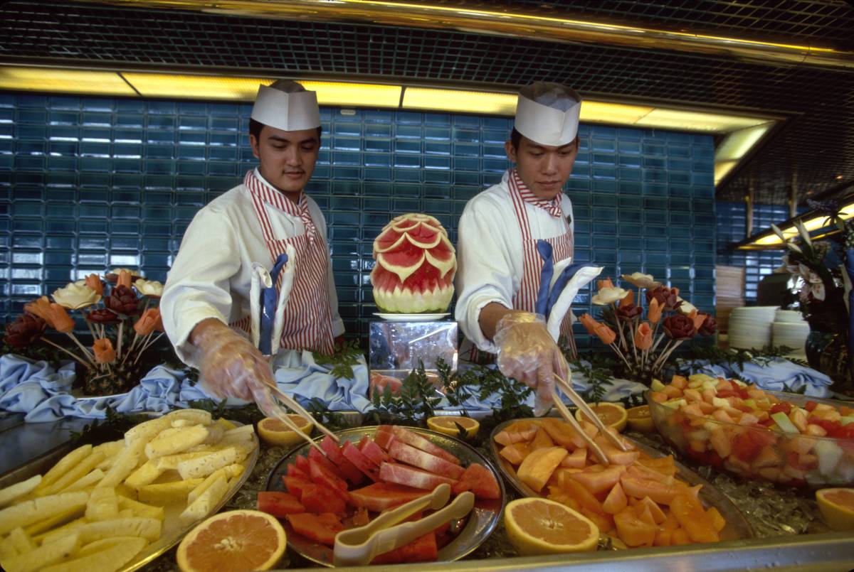 <p>You can safely eat at a buffet while traveling. However, you may want to go in with a strategy. According to food science professor Randy Worobo, buffet foods risk entering the "danger zone" between 40 and 140 degrees Fahrenheit. In other words, if foods are kept lukewarm, they may harbor dangerous bacteria.</p> <p>Avoid foods that sit in room temperature for a long time. Cooked meals should be hot, not warm. If the buffet is busy, then the food is more likely to be fresh. Ignore anything that looks wilted or could be unwashed.</p>