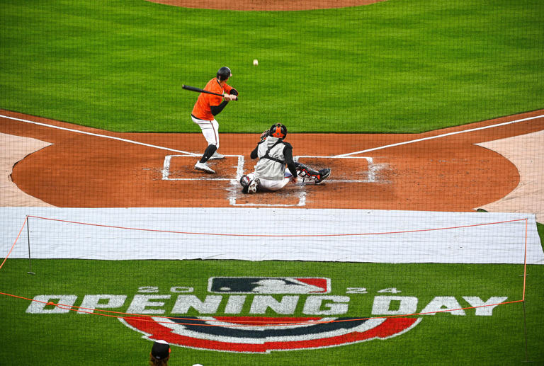 Mar. 26, 2024: Orioles held a workout at Camden Yards before their 2024 Opening Day game on Thursday against the Los Angeles Angels at Orioles Park. Orioles Austin Hays looks at a pitch from Dean Kremer (not shown) with catcher Adley Rutschman behind the plate.