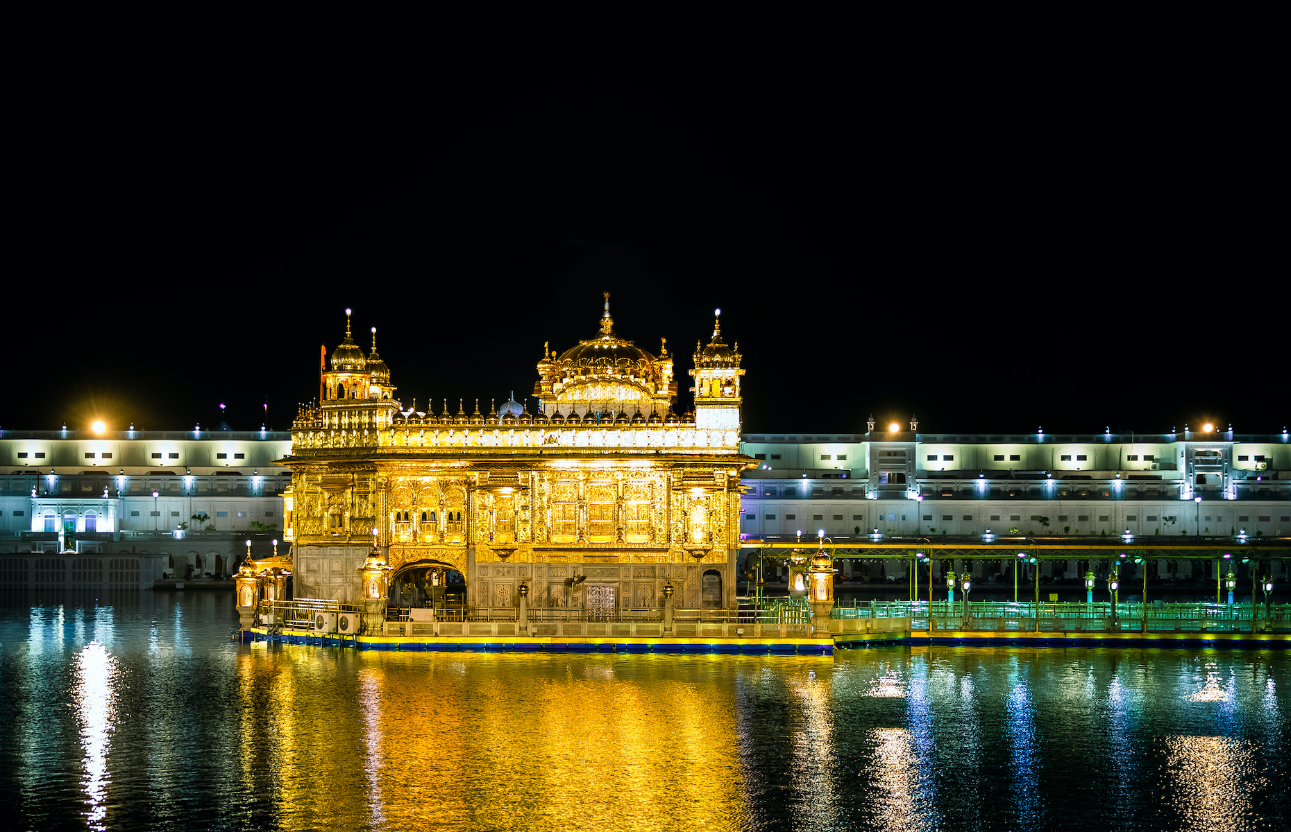 <p>The Harmandir Sahib, also known as the Golden Temple, is the holiest Sikh shrine. The building, completed in 1604, is topped by domes covered with gold plates and decorated with multi-coloured <a href="https://www.goldentempleamritsar.org/famous-temples-in-india/amritsar/golden-temple/art-and-architecture.php" rel="noreferrer noopener">marble and semi-precious stones.</a> Its location, below the level of the city, is supposed to symbolize humility. Nearly 100,000 pilgrims visit the site, and many bathe each day in the waters of its basin, which are believed to have healing powers.</p>