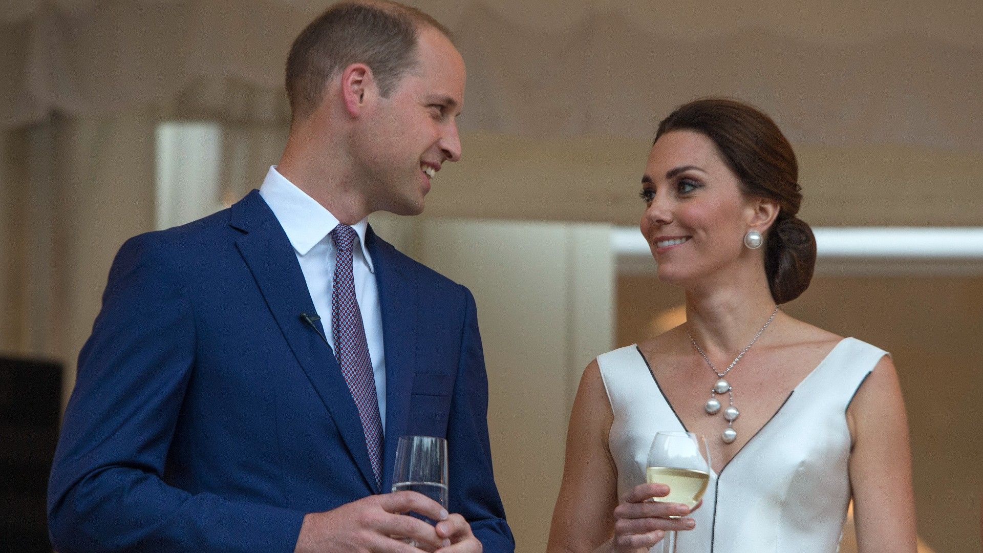 <p>                     In 2017, while on a tour of Poland and Germany, William and Kate attended a party in honour of the late Queen Elizabeth's birthday.                   </p>                                      <p>                     It was attended by over 600 guests and William delivered a speech to the packed party where he reportedly opened the speech with a greeting in Polish.                   </p>                                      <p>                     If that wasn't a memorable moment in itself, Kate pulled off an elegant, timeless look.                   </p>                                      <p>                     Wearing a bespoke white cocktail dress by Polish designer Gosia Baczyńska, Kate complemented the delicate dress with a most enchanting set of pearl jewellery, including oversized earrings from Balenciaga and a cascading necklace with four large pearls.                   </p>