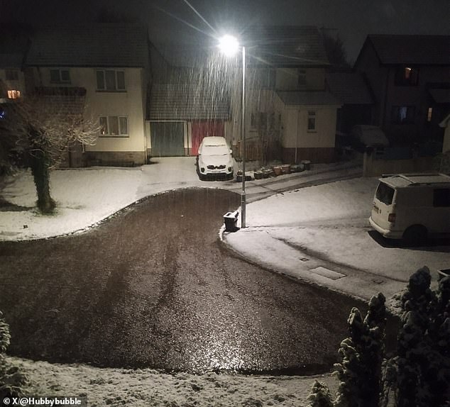 uk weather: storm nelson batters the country with map showing where 70mph winds, heavy rain, hail and thunder will hit as temperatures dip to 0c - and snow blankets parts of wales and southern england