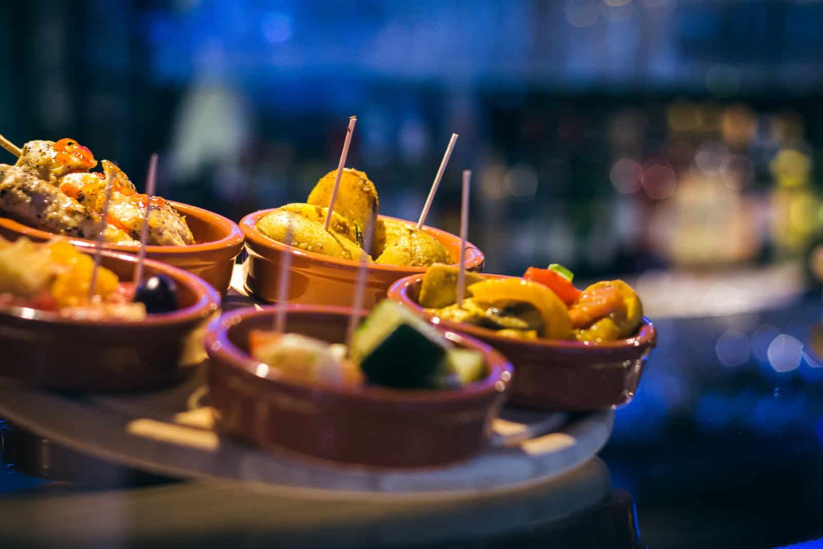 Image Credit: Shutterstock / Takin’ Shotz <p><span>Step into the lively atmosphere of Spain’s traditional tapas bars, known as “bodegas” or “tascas,” where locals gather to enjoy small plates, good company, and lively conversation. Experience the authentic ambiance of these beloved institutions, where every tapa tells a story of culinary tradition and community.</span></p>