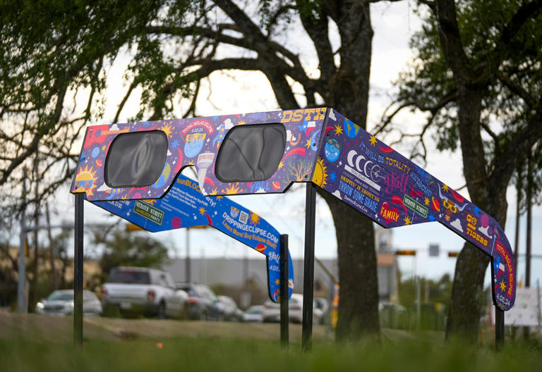 A model of oversized solar eclipse glasses located at a park in Dripping Springs, Texas on Monday, March 18, 2024.