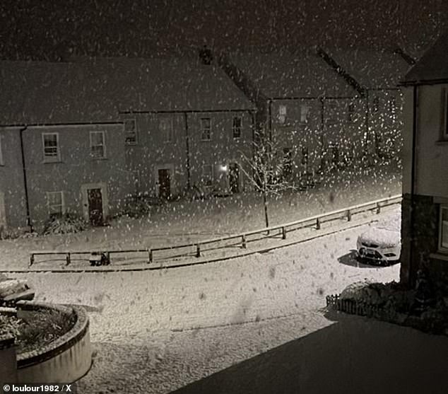 uk weather: storm nelson batters the country with map showing where 70mph winds, heavy rain, hail and thunder will hit as temperatures dip to 0c - and snow blankets parts of wales and southern england