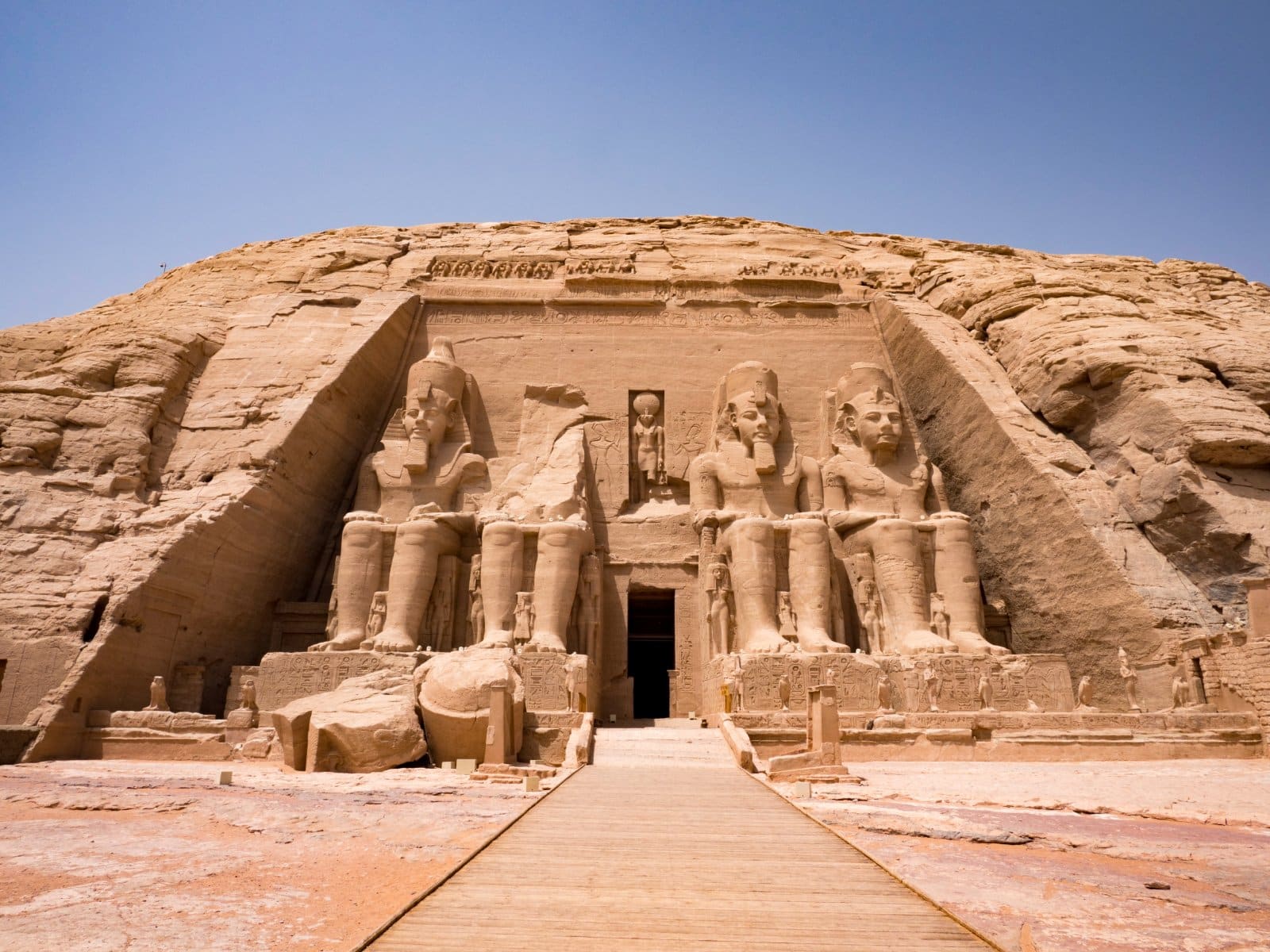 <p class="wp-caption-text">Image Credit: Shutterstock / doleesi</p>  <p><span>Abu Simbel remains one of Egypt’s most awe-inspiring sites, where Ramses II and his queen, Nefertari’s colossal temples overlook Lake Nasser. Constructed in the 13th century BC, these temples were an assertion of Ramses II’s divine might and his love for Nefertari. The relocation of these temples in the 1960s, a monumental effort to save them from the rising waters of Lake Nasser due to the Aswan High Dam, stands as a testament to global cooperation for preserving cultural heritage. The grandeur of the statues, the intricate wall carvings depicting victorious battles, and the alignment of the sun during the Sun Festival, illuminating the inner sanctum, all contribute to the site’s mystique and grandiosity.</span></p>