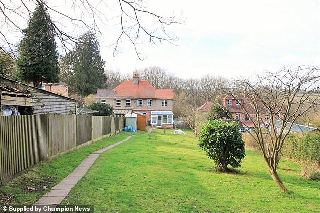 is this britain's most bitter neighbour dispute? father-of-five who was jailed and handed £475,000 court bill after threatening couple next door amid row over position of a garden fence is now ordered to sell his £420,000 home
