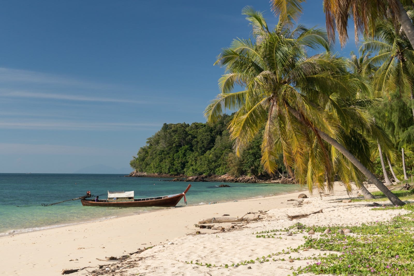 <p class="wp-caption-text">Image Credit: Shutterstock / Michelle Holihan</p>  <p><span>Koh Bulon Lae is a testament to tranquility and sustainable living, starkly contrasting Thailand’s more commercialized islands. This small island paradise in the Satun Province has lush jungles, white sandy beaches, and crystal-clear waters, providing a serene backdrop for a relaxing getaway. The local communities here, including the Moken Sea Nomads, live in harmony with their surroundings, offering insights into a lifestyle that prioritizes environmental preservation and simplicity. The island’s commitment to eco-tourism is evident in its minimal development, with a handful of low-impact resorts and bungalows emphasizing conservation and cultural respect. The beaches, particularly Panka Yai and Panka Noi, are perfect for those seeking solitude and a chance to connect with nature, while the surrounding coral reefs offer snorkelers a vibrant underwater world to explore. Koh Bulon Lae is a destination where time seems to stand still, inviting visitors to step into a slower pace of life and embrace the beauty of unspoiled nature.</span></p>