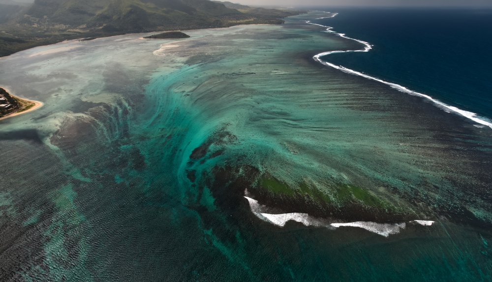 <p>The underwater waterfall-look is created by the sand that is moved back-and-forth over the shallow shelves by the ocean currents.</p>