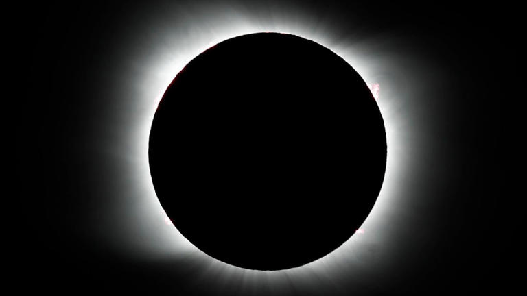 The moon covers the sun during a total solar eclipse in Piedra del Aguila, Argentina, Monday, Dec. 14, 2020. The total solar eclipse was visible from the northern Patagonia region of Argentina and from Araucania in Chile, and as a partial eclipse from the lower two-thirds of South America.